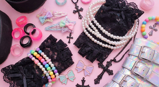 A vibrant flat lay of Harajuku accessories including hair clips, chunky rings, chokers, and beaded bracelets mixing gothic and kawaii aesthetics in pastel and black tones.
