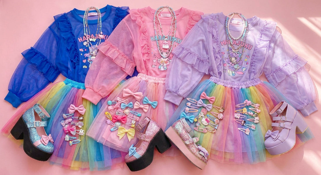 A colorful flat lay of layered Harajuku fashion pieces including platform shoes, sheer tops, tulle skirts, and kawaii accessories arranged on a pastel pink surface.