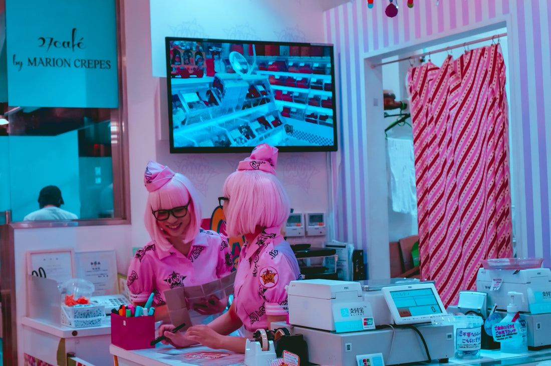 two women in pink in cafe