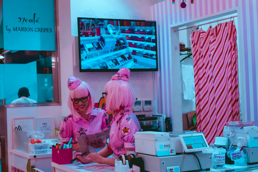 two women in pink in cafe