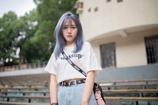 woman in white crew neck t-shirt and blue denim shorts