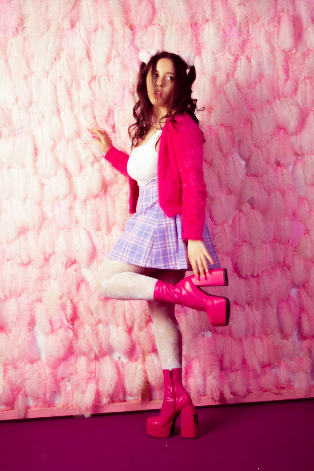a woman in a short skirt and pink jacket