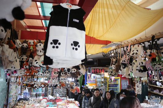 Panda themed merchandise displayed at a market stall.